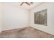 Bedroom featuring neutral carpet, window with blinds, and a ceiling fan at 125 N 22Nd Pl # 128, Mesa, AZ 85213