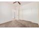 Bedroom with carpet, closet, and doors leading to other rooms in the home at 125 N 22Nd Pl # 128, Mesa, AZ 85213
