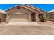 Charming single-story home featuring a two-car garage and landscaped front yard at 125 N 22Nd Pl # 128, Mesa, AZ 85213