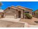 Inviting single-story home with a well-maintained front yard and two-car garage at 125 N 22Nd Pl # 128, Mesa, AZ 85213