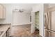 The kitchen is adjacent to the dining area with a pantry for additional storage at 125 N 22Nd Pl # 128, Mesa, AZ 85213