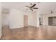 Open-concept living room with tile flooring and access to the kitchen and patio at 125 N 22Nd Pl # 128, Mesa, AZ 85213