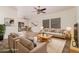 Bright living room with ceiling fan, neutral colors, open to dining area and modern furnishings for comfortable living at 125 N 22Nd Pl # 128, Mesa, AZ 85213