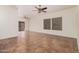 Bright living room with tile flooring, ceiling fan, and sliding glass door to the patio at 125 N 22Nd Pl # 128, Mesa, AZ 85213