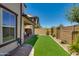 Green backyard featuring artificial turf, perfect for outdoor activities and low-maintenance landscaping at 1255 N Arizona Ave # 1013, Chandler, AZ 85225