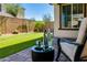 Relaxing outdoor patio space with comfortable seating and a well-maintained artificial grass yard at 1255 N Arizona Ave # 1013, Chandler, AZ 85225