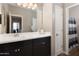 Clean bathroom with a double sink vanity, ample countertop space, and a shower/tub combo behind a door at 1255 N Arizona Ave # 1013, Chandler, AZ 85225