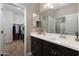Well-lit bathroom with double sink vanity, a large mirror, and convenient access to a walk-in closet at 1255 N Arizona Ave # 1013, Chandler, AZ 85225