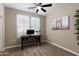 Bright bedroom with a desk area, carpeted floors, and ample natural light perfect for a home office at 1255 N Arizona Ave # 1013, Chandler, AZ 85225