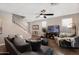 Bright living room with staircase, ceiling fan, tv and comfortable sofas at 1255 N Arizona Ave # 1013, Chandler, AZ 85225