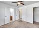 Bedroom featuring neutral carpet, doors to bath, closet and hallway at 12602 N 38Th Ave, Phoenix, AZ 85029