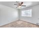 A bright bedroom with carpet, ceiling fan, and natural light from a window at 12602 N 38Th Ave, Phoenix, AZ 85029