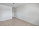 A bedroom featuring tile floors and neutral wall paint at 12602 N 38Th Ave, Phoenix, AZ 85029