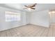 Bedroom featuring neutral-toned tile flooring and a ceiling fan at 12602 N 38Th Ave, Phoenix, AZ 85029
