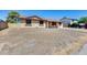A single-story home displaying a spacious front yard at 12602 N 38Th Ave, Phoenix, AZ 85029