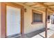 A well-maintained front entrance with a classic white door and warm exterior lighting at 12602 N 38Th Ave, Phoenix, AZ 85029