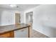 View of the kitchen, including the granite counter, leading to other rooms in the house at 12602 N 38Th Ave, Phoenix, AZ 85029