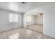Well-lit living room with neutral tile, large windows, and archway to other spaces at 12602 N 38Th Ave, Phoenix, AZ 85029