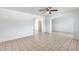 Bright living room with neutral-toned tile flooring and minimalist decor at 12602 N 38Th Ave, Phoenix, AZ 85029