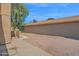 View of a home's yard with gravel landscaping and a tree at 12842 S Wakial Loop, Phoenix, AZ 85044