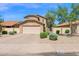 Charming two-story home with a well-maintained front yard and an attached two-car garage at 12842 S Wakial Loop, Phoenix, AZ 85044