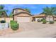 Two story home with a two car garage and mature landscaping at 12842 S Wakial Loop, Phoenix, AZ 85044