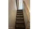 Carpeted stairwell with a handrail at 12842 S Wakial Loop, Phoenix, AZ 85044