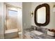 Bathroom features stylish finishes, including a marble countertop and shower with a tub at 12887 N 135 St, Scottsdale, AZ 85259
