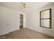 Bedroom features wood floors, closet, and bright lighting at 12887 N 135 St, Scottsdale, AZ 85259