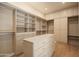 Spacious walk-in closet with custom shelving and storage solutions at 12887 N 135 St, Scottsdale, AZ 85259