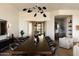Bright dining room with large table, modern lighting, and bar area is great for dinner parties at 12887 N 135 St, Scottsdale, AZ 85259