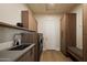 Modern laundry room with ample cabinet space, sink, and modern appliances at 12887 N 135 St, Scottsdale, AZ 85259