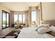 Bright main bedroom with a seating area, large windows and exterior views at 12887 N 135 St, Scottsdale, AZ 85259