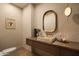 Chic powder room featuring modern fixtures and a unique vessel sink at 12887 N 135 St, Scottsdale, AZ 85259