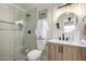 Beautifully updated bathroom with a glass-enclosed shower and modern vanity at 1352 W Naranja Ave, Mesa, AZ 85202