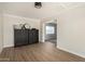 Dining area with stylish dark cabinets and wood flooring, offering an elegant space at 1352 W Naranja Ave, Mesa, AZ 85202