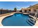 Backyard pool with pool steps and stone trim at 1352 W Naranja Ave, Mesa, AZ 85202