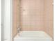 Bathroom with a tiled shower and bathtub combination at 1439 N 53Rd Ave, Phoenix, AZ 85043