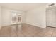 A light-filled bedroom with tile flooring and patio doors leading to outdoor space at 1439 N 53Rd Ave, Phoenix, AZ 85043