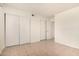 Simple bedroom with tile flooring, closet with sliding doors, and overhead lighting at 1439 N 53Rd Ave, Phoenix, AZ 85043