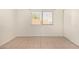 Bright bedroom with tile flooring, a closet and a window overlooking the outdoors at 1439 N 53Rd Ave, Phoenix, AZ 85043