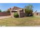 Well maintained desert landscaping accents this multi-level home with a neatly kept lawn at 1439 N 53Rd Ave, Phoenix, AZ 85043