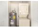 Convenient laundry closet with stackable washer and dryer and water heater at 1439 N 53Rd Ave, Phoenix, AZ 85043