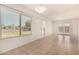 Bright living room with neutral tile floors, large windows, and access to the outdoors at 1439 N 53Rd Ave, Phoenix, AZ 85043
