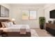 Comfortable main bedroom with wooden furniture, area rug, and a window allowing plenty of light at 1439 N 53Rd Ave, Phoenix, AZ 85043