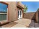 Private outdoor patio with textured stucco wall, perfect for relaxing and enjoying the fresh air at 1439 N 53Rd Ave, Phoenix, AZ 85043