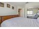 Comfortable bedroom with a bed, mirror closet doors, and neutral colored walls at 1628 E Aspen Ave, Buckeye, AZ 85326