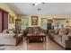 Comfortable living room with neutral decor and comfortable sofas, perfect for Gathering gatherings at 1628 E Aspen Ave, Buckeye, AZ 85326