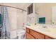Clean bathroom featuring a shower-tub combo and updated vanity at 16288 W Hadley St, Goodyear, AZ 85338