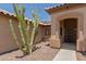 Welcoming front entry featuring desert landscaping and a covered entryway at 16288 W Hadley St, Goodyear, AZ 85338